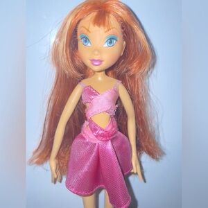Winx club doll Bloom first wave wearing singsational Stella dress.